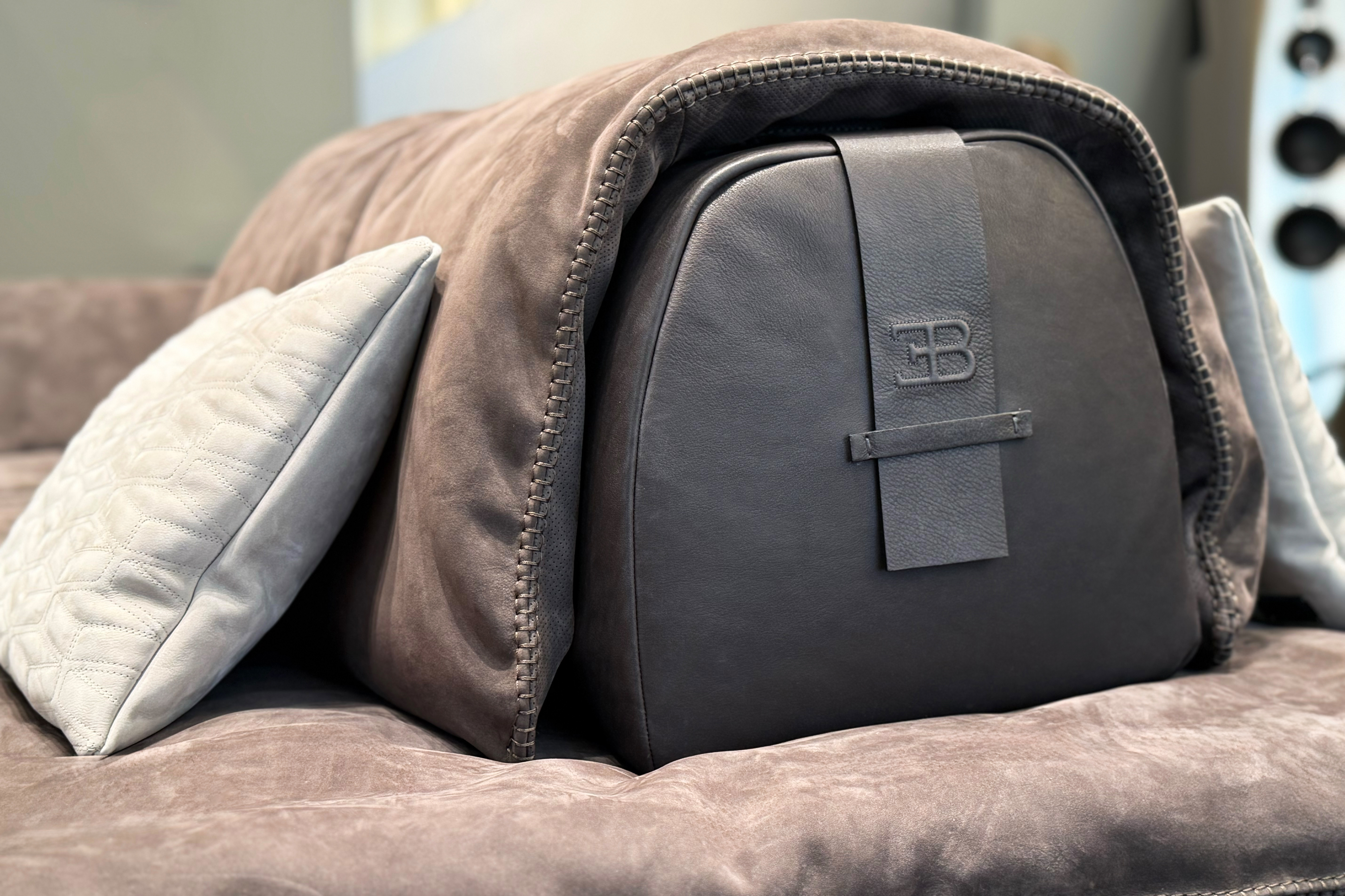 The leather strap of the new TYPE_21 modular sofa is integrated into the armrest as a subtle reference to the marque’s automotive codes.